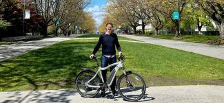 Dr. Bigazzi poses with e-bike at UBC