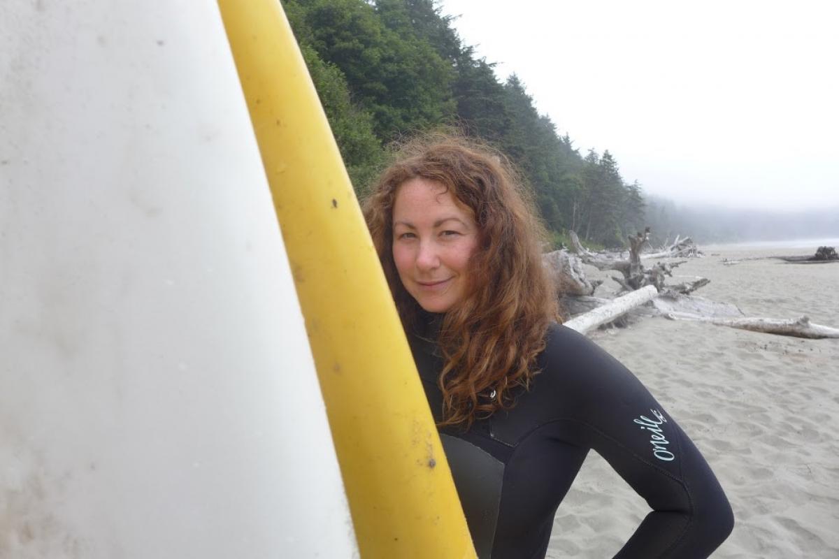 Britanny Morris posing with a surfboard