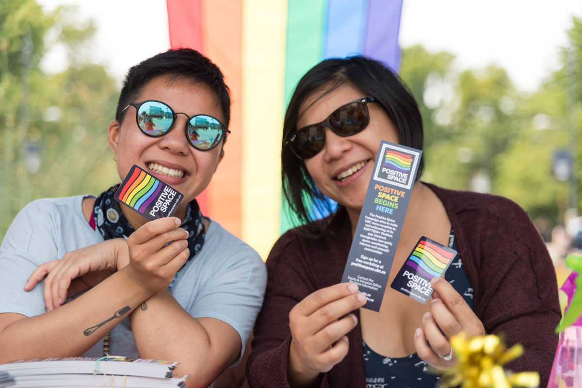 Members of the UBC community display their "Positive Space" stickers.