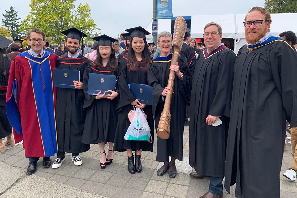 UBC Manufacturing Engineering first graduating class poses in their cap and gowns during Graduation 2022 ceremonies.