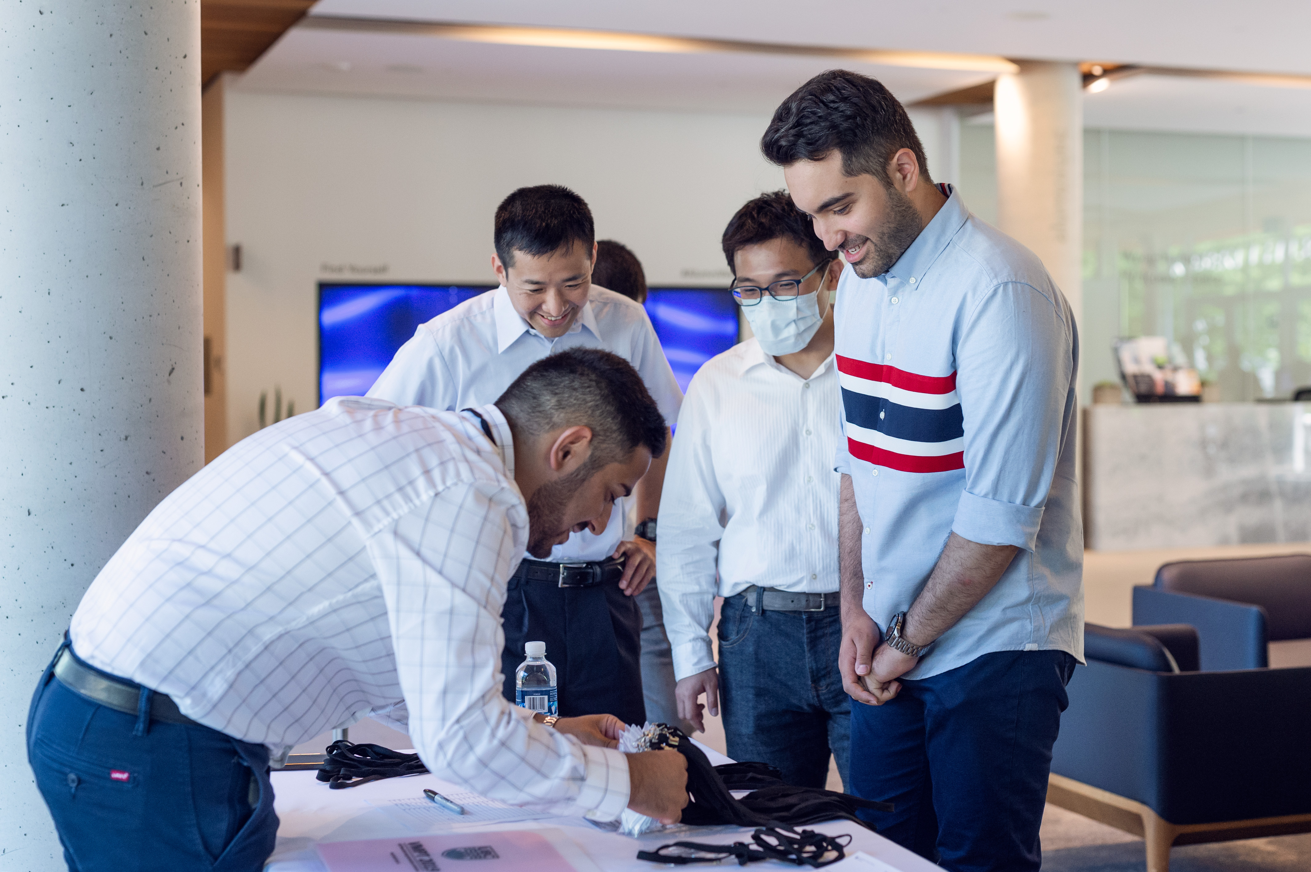 people signing a paper