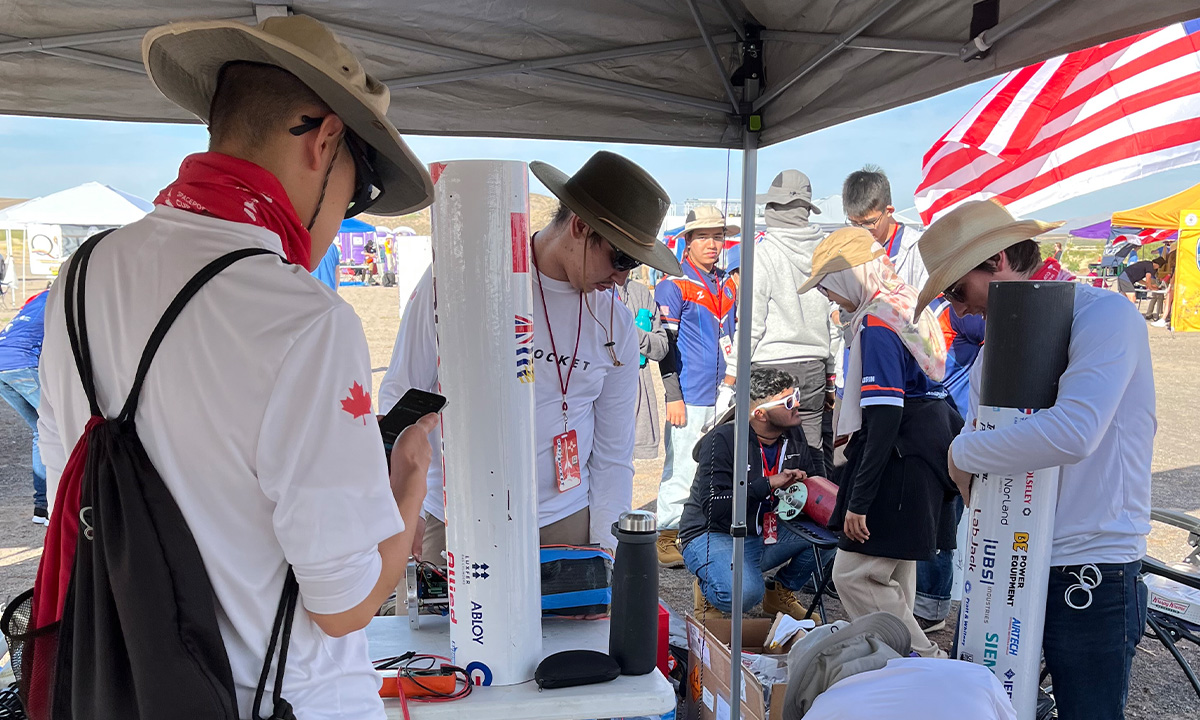 students working on rocket