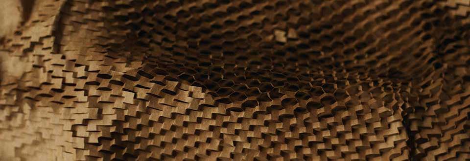 Close-up of brown honeycomb cardboard packaging material.