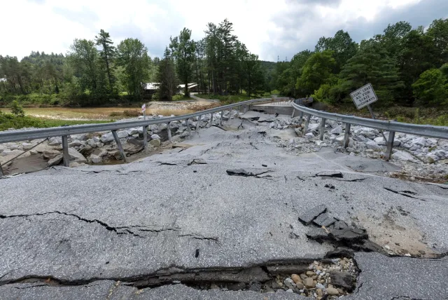 Cracked road with trees behind