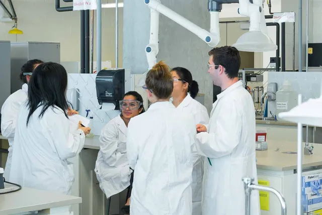 a picture of a group of people in a laboratory.