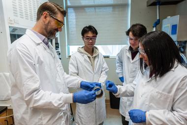 Dr. Yasmine Abdin and Dr. Scott Renneckar examining carbon fibre spun out of bitumen