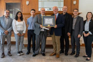 Group photo with Said El Mejdani in centre, receiving the McEwen Family Teacher Recognition Award from Dr. Jim McEwen