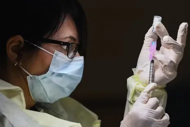 Woman holding vaccine