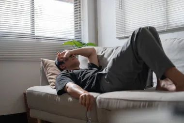 Man lying on couch