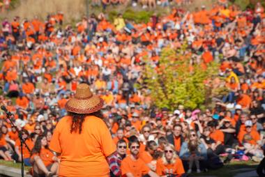 Dana-Lyn Mackenzie addresses a crowd at the Intergenerational March to Commemorate Orange Shirt Day