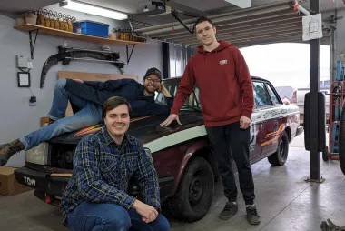 Alumni get-together building a "racecar"