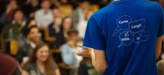 The back of a man clapping