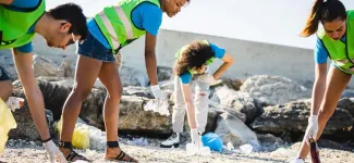 Students doing a beach clean up