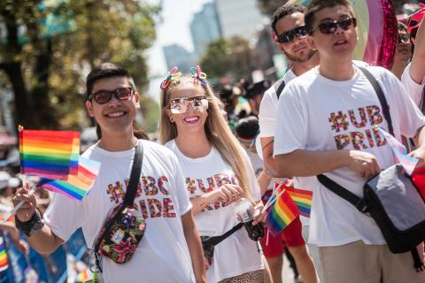 UBC students at a pride parade in 2019 wearing #ubcpride t-shirts.