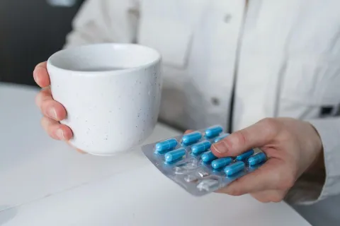Person holding medicine blister pack