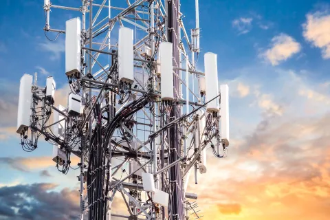 5G communications tower at sunset