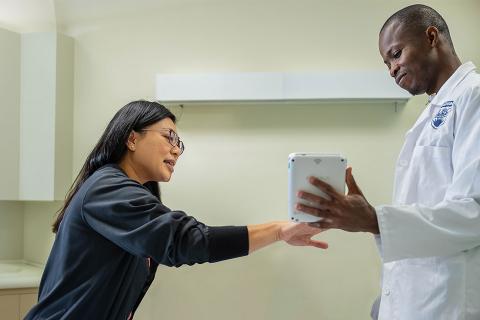 A UBC nurse practitioner student with a patient