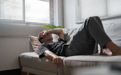 Man lying on couch