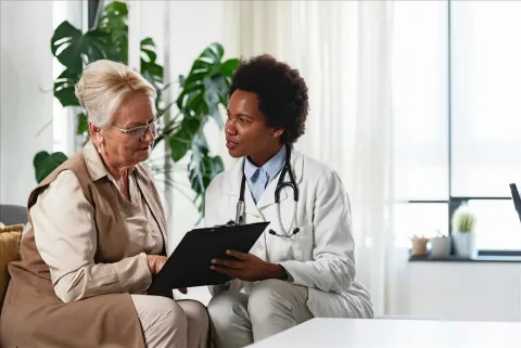 Nurse with elderly patient
