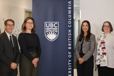 James Olson, Alexandra Jude, Jessie Sunner and Elizabeth Saewyc stand in front of a University of British Columbia banner at the new nurse practitioner facility